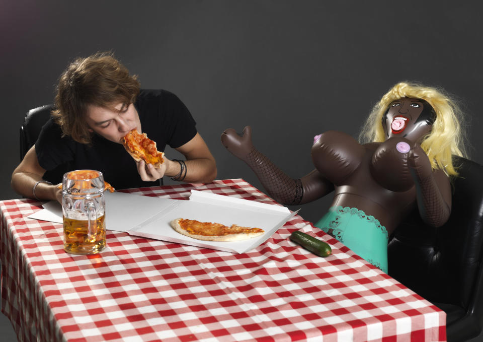 This perplexing&nbsp;stock photo features one lucky man&nbsp;splitting some 'za with his&nbsp;"mistress plastic"