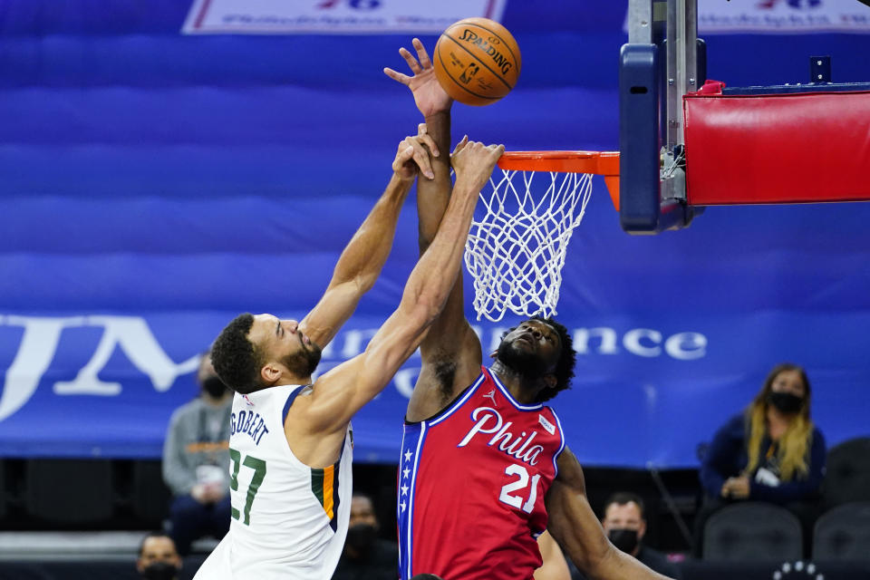 Utah Jazz's Rudy Gobert, left, cannot get a dunk past Philadelphia 76ers' Joel Embiid during the second half of an NBA basketball game, Wednesday, March 3, 2021, in Philadelphia. (AP Photo/Matt Slocum)