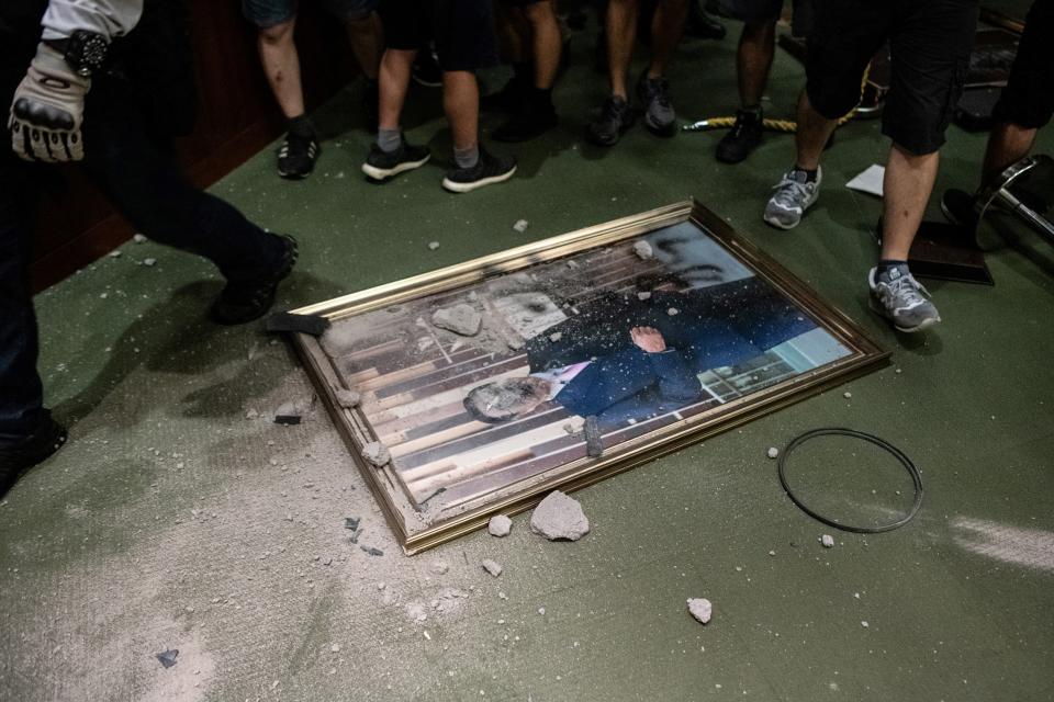 The portrait of chairman of the Legislative Council Andrew Leung is destroyed after protesters broke into the parliament chamber of the government headquarters in Hong Kong on July 1, 2019. (Photo: Philip Fong/AFP/Getty Images)