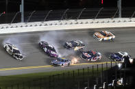 Aric Almirola (10), Alex Bowman (48) and Kaz Grala (16) get caught up in a crash coming out of Turn 4 as Kyle Larson (5), Cole Custer (41), Landon Cassill (96) and Joey Gase (15) try to avoid the wreck during the NASCAR Cup Series auto race at Daytona International Speedway, Saturday, Aug. 28, 2021, in Daytona Beach, Fla. (AP Photo/David Graham)