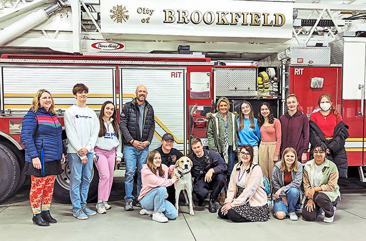 Brookfield Central High School's PAWS group visiting Koda at the fire department