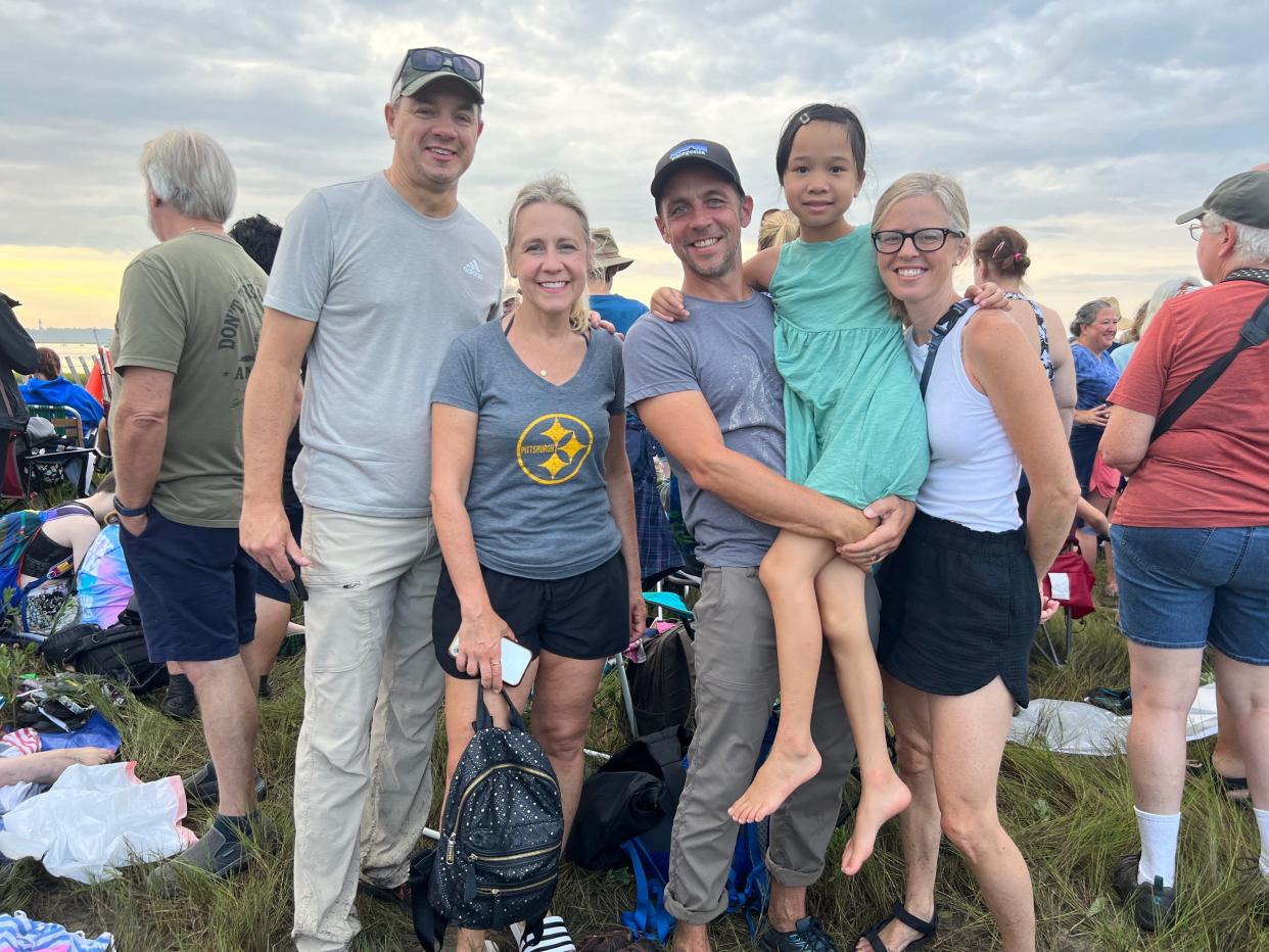 Jeff Bogaczyk, 53, wife Lisa Bogaczyk, 52, Wisconsin, along with Jon Kuert, 48, daughter Gili, 10, and wife Elissa Kuert, 45, Minnesota, made the trek to see the Chincoteague Pony Swim on July 27, 2022.