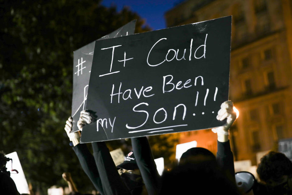 <i>During a June 1 protest near the White House over the death of George Floyd, a demonstrator holds a sign that says: "It could have been my son."</i>