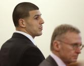 Former New England Patriots football player Aaron Hernandez (L) and defense attorney Charles Rankin listen during his trial in Fall River, Massachusetts, January 29, 2015, Hernandez is accused of murdering semi-professional football player Odin Lloyd. REUTERS/Steven Senne/Pool (UNITED STATES - Tags: SPORT FOOTBALL CRIME LAW)