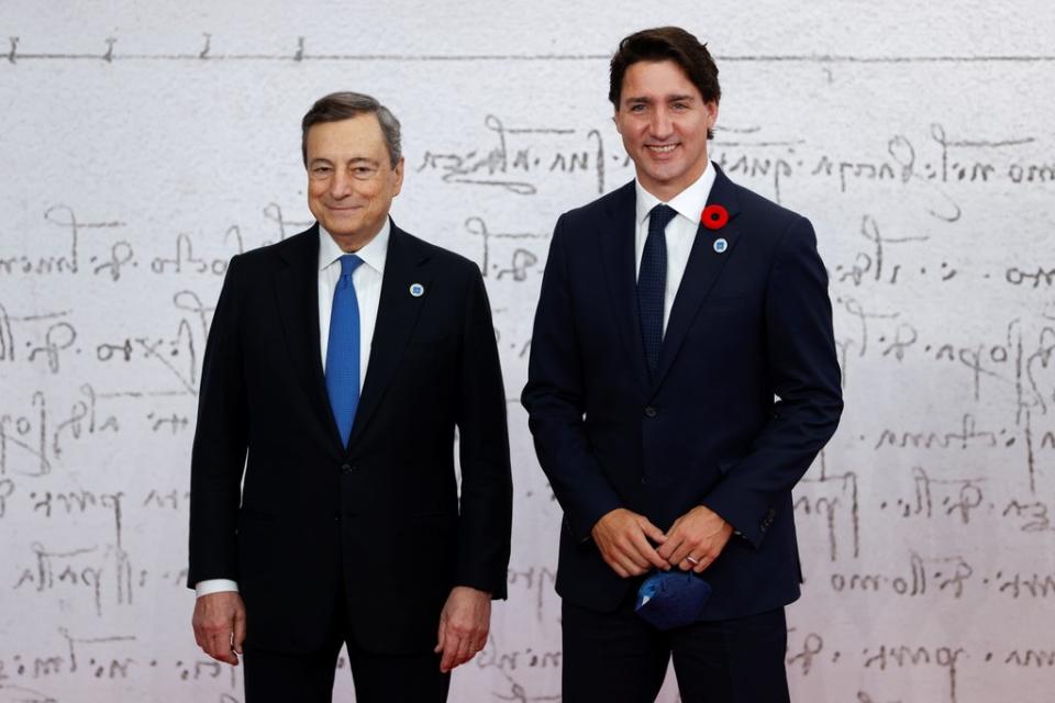 Italian Prime Minister Mario Draghi poses with Canada's Prime Minister Justin Trudeau (REUTERS)