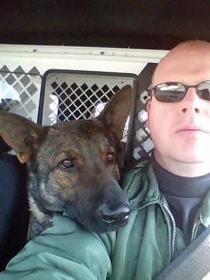 Boone Sheriff Deputy Dallas Wingate is pictured with his K9 officer Bandit in 2018. Wingate and Bandit were instrumental in locating the convicted murderer of Iowa State University golfer Celia Barquin Arozamena in 2018. Wingate has submitted his resignation to the Boone County Supervisors and is under investigation by the Iowa Department of Criminal Investigation after being placed on administrative leave Aug. 31, 2022. Wingate's most recent K9 partner, Bear, died while in Wingate's custody on Sept. 2, 2022.