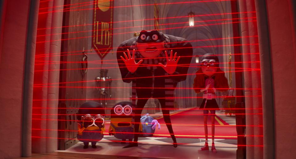 Gru (voiced by Steve Carell, center) goes on a heist with his Minions and supervillain wannabe Poppy (Joey King) in "Despicable Me 4."