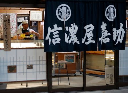 Confectionery shop owner Shigeyuki Kaneta, 46, works at his shop in Nanmoku Village, northwest of Tokyo, Japan October 12, 2017. Picture taken October 12, 2017. REUTERS/Issei Kato