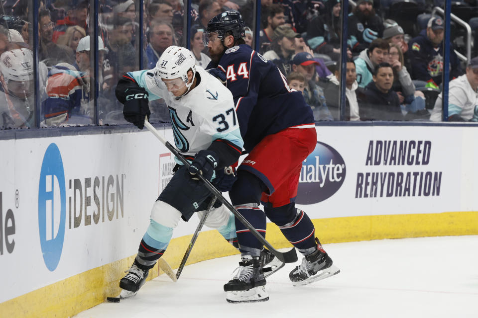 Columbus Blue Jackets' Erik Gudbranson, right, tries to check Seattle Kraken's Yanni Gourde during the third period of an NHL hockey game Friday, March 3, 2023, in Columbus, Ohio. (AP Photo/Jay LaPrete)