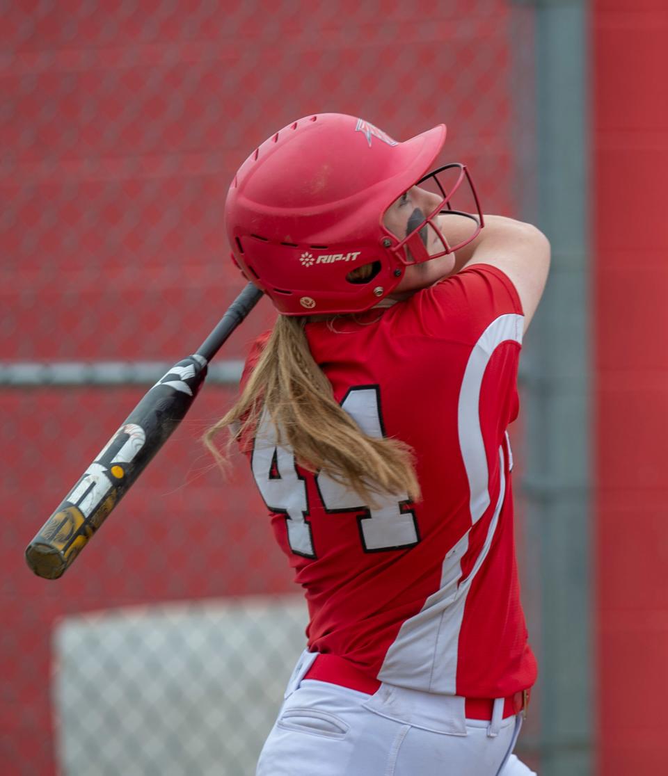 Megan Schmidt, shown taking a swing against Hudson last year, is one of the area's leading hitters.