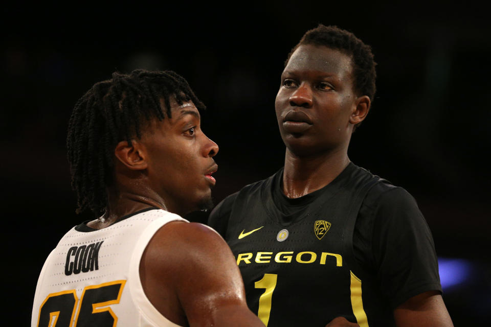 Iowa Hawkeyes forward Tyler Cook (25) defends Oregon Ducks center Bol Bol (1) on an in-bounds play during the second half at Madison Square Garden. Mandatory Credit: Brad Penner-USA TODAY Sports