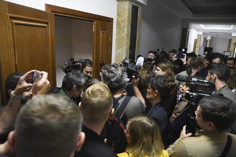 Journalists enter a courtroom to take photos and videos of Wall Street Journal reporter Evan Gershkovich prior to hearing in a court in Yekaterinburg, Russia, Wednesday, June 26, 2024. Fifteen months after he was arrested in the city of Yekaterinburg on espionage charges, Gershkovich returns there for his trial starting Wednesday, June 26, 2024, behind closed doors. Gershkovich, his employer and the U.S. government deny the charges. (AP Photo)