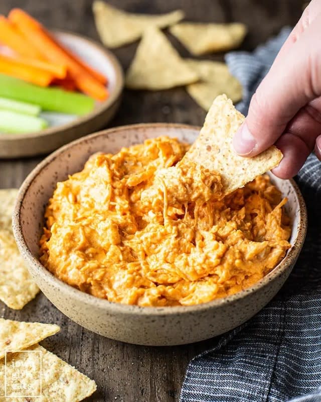 <p>Iowa Girl Eats</p><p>This is to be the number one dip at any party!</p><p><strong>Get the recipe: <a href="https://iowagirleats.com/crock-pot-buffalo-chicken-dip/" rel="nofollow noopener" target="_blank" data-ylk="slk:Crock Pot Buffalo Chicken Dip;elm:context_link;itc:0;sec:content-canvas" class="link rapid-noclick-resp">Crock Pot Buffalo Chicken Dip</a></strong></p>