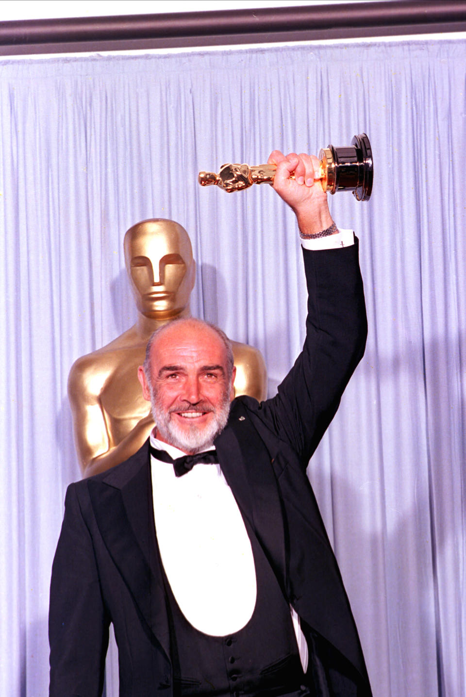 Sean Connery holds his first Oscar at the 60th annual Academy Awards in 1988. Connery won for best supporting actor for his role in "The Untouchables."