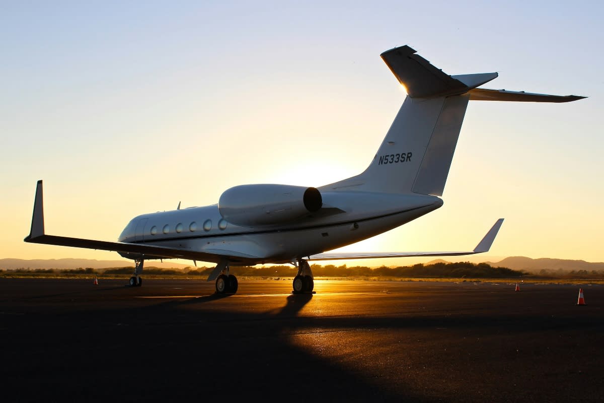 plane on runway at airport during sunset in the US