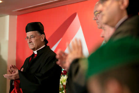 Lebanese Maronite Patriarch Bechara Boutros Al-Rahi claps as he visits the Lebanese embassy in Riyadh, Saudi Arabia, November 13, 2017. REUTERS/Faisal Al Nasser