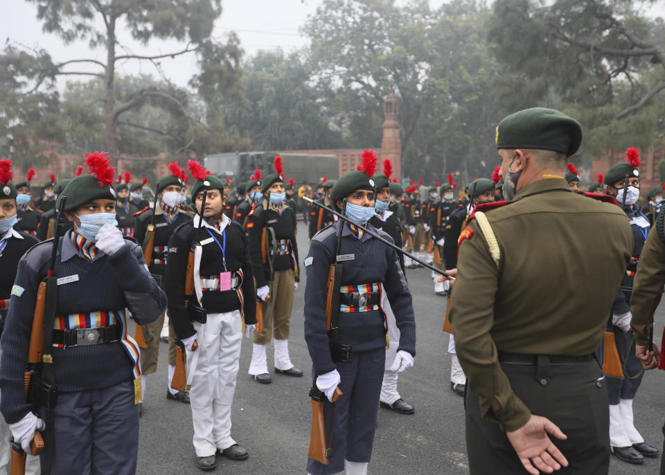 An Army instructor briefs national Cadet Corp students as they prepare for the upcoming Republic Day parade at the Raisina hills, the government seat of power, in New Delhi, India, Monday, Jan. 18, 2021. Republic Day marks the anniversary of the adoption of the country's constitution on Jan. 26, 1950. Thousands congregate on Rajpath, a ceremonial boulevard in New Delhi, to watch a flamboyant display of the country’s military power and cultural diversity. (AP Photo/Manish Swarup)