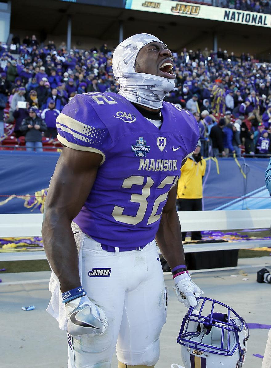 James Madison running back Khalid Abdullah (32) sheds tears as he celebrates after their win against Youngstown State in the FCS championship NCAA college football game, Saturday, Jan. 7, 2017, in Frisco, Texas. Abdullah earned the game most valuable player award in the game. (AP Photo/Tony Gutierrez)