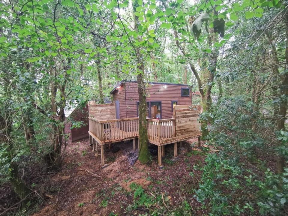 <p><strong>Sleeps:</strong> 2</p><p>This adorable little chalet is perfect for a treehouse holiday in Wales, where you're surrounded by nature and have all the essentials you need for a mini-break. With its glorious garden views, this treehouse has a balcony, hot tub and flatscreen TV, as well as barbecue facilities. It sits around 12 miles from Carmarthen Castle for the perfect day out during your stay, and it comes highly rated by treehouse fans who say they'll be back for another stay. </p><p><a class="link " href="https://www.booking.com/hotel/gb/tiny-house-hot-tub-st-clears-pembrokeshire-tenby.en-gb.html?aid=2070936&label=hb-treehouse-holidays" rel="nofollow noopener" target="_blank" data-ylk="slk:CHECK AVAILABILITY;elm:context_link;itc:0;sec:content-canvas">CHECK AVAILABILITY</a></p>