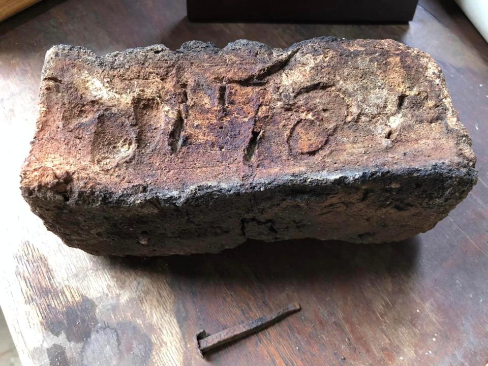 A hand formed, dated brick discovered at the historic 18th century Blick Plantation in Lawrenceville, Virginia. Do you see the fingerprints?