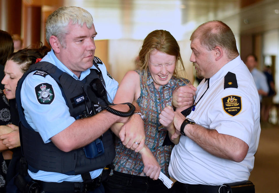Protester removed from the Parliament House, Canberra, Australia