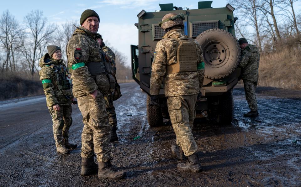 Soldiers prepare to head back to the front outside of the heavily damaged city of Bakhmut, which has become one of the most intense battles in the nearly year-long war with Russia on Jan. 19, 2023, in Bakhmut, Ukraine. The comfort centers offer besieged residents food, coffee, tea, warmth, and charging areas. Russia has stepped up its offensive in the Donetsk region in the new year, with the region's Kyiv-appointed governor accusing Russia of using scorched-earth tactics.