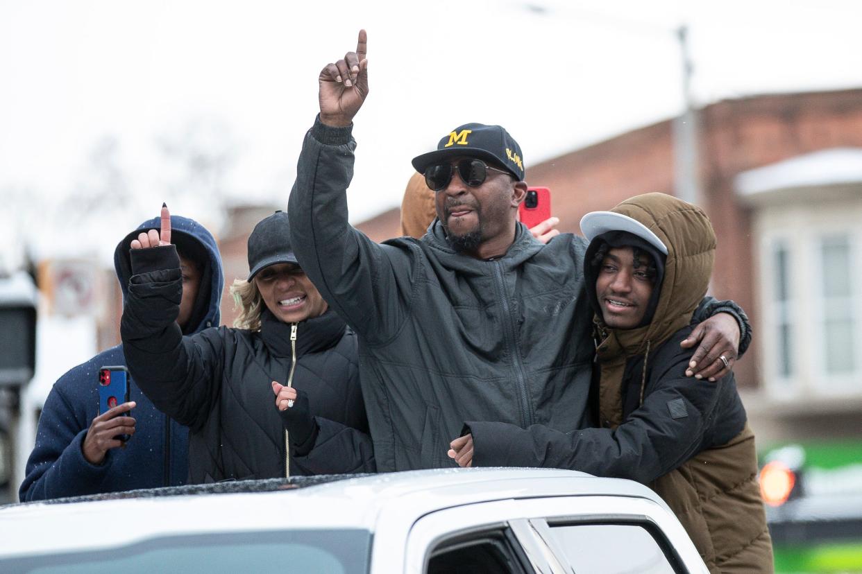 Michigan co-defensive coordinator Steve Clinkscale waves at the fans during the National Championship parade in Ann Arbor on Saturday, Jan. 13, 2024.