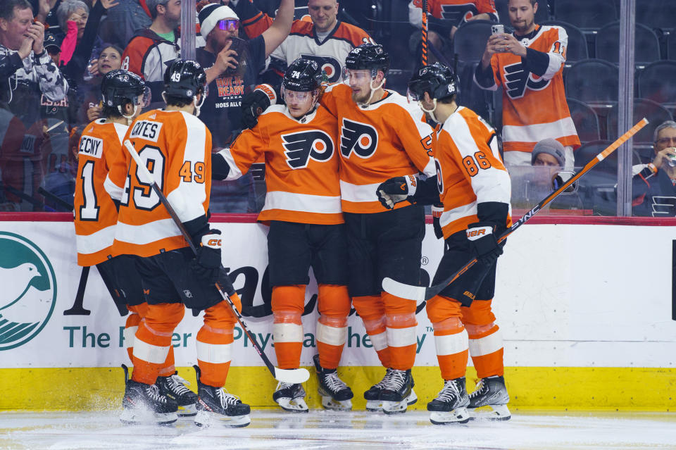 Philadelphia Flyers' Owen Tippett, center, celebrates his goal against the Columbus Blue Jackets with teammates during the second period an NHL hockey game Tuesday, April 11, 2023, in Philadelphia. (AP Photo/Chris Szagola)