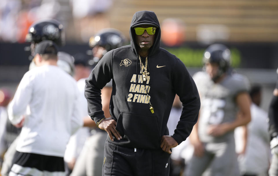 Colorado head coach Deion Sanders looks on as players warm up before an NCAA college football game against Southern California Saturday, Sept. 30, 2023, in Boulder, Colo. (AP Photo/David Zalubowski)
