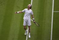 Russia's Andrey Rublev reacts after winning a point against Serbia's Novak Djokovic in a men's singles match on day nine of the Wimbledon tennis championships in London, Tuesday, July 11, 2023. (AP Photo/Alberto Pezzali)