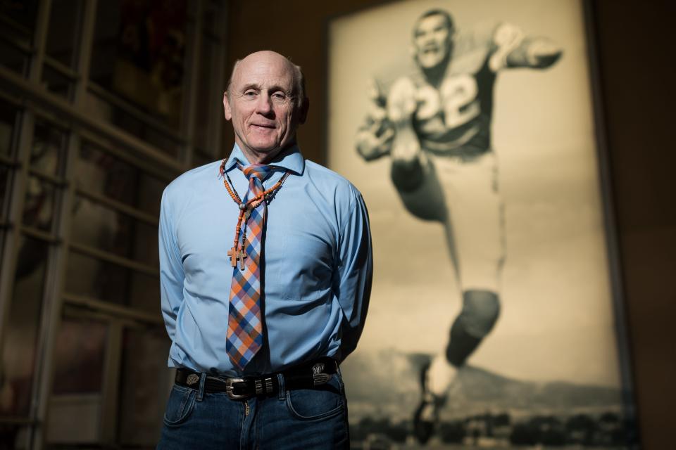 Nate Poss, director of football operations for UTEP, stands for a portrait at the Larry K. Durham Sports Center next to a photo of Larry K. Durham on Thursday, Jan. 11, 2024. Poss is retiring after 27 years.