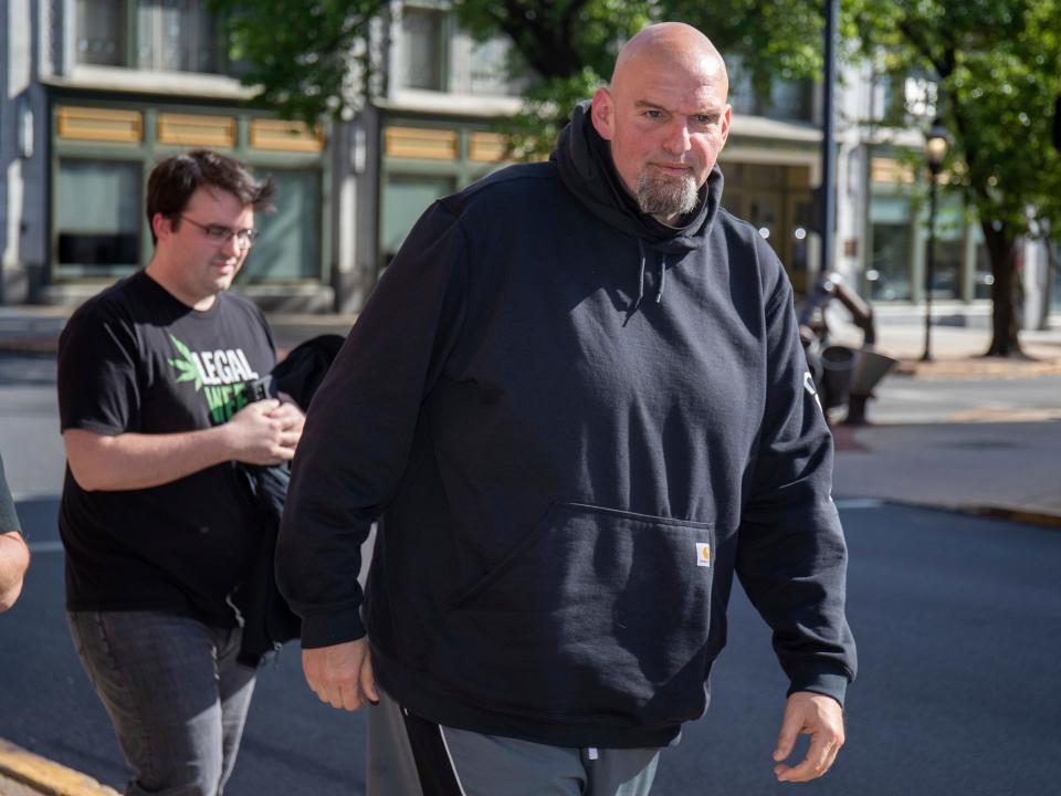 John Fetterman arrives at the Holy Hound Tap Room in downtown York, Pa., Thursday, May. 12, 2022.