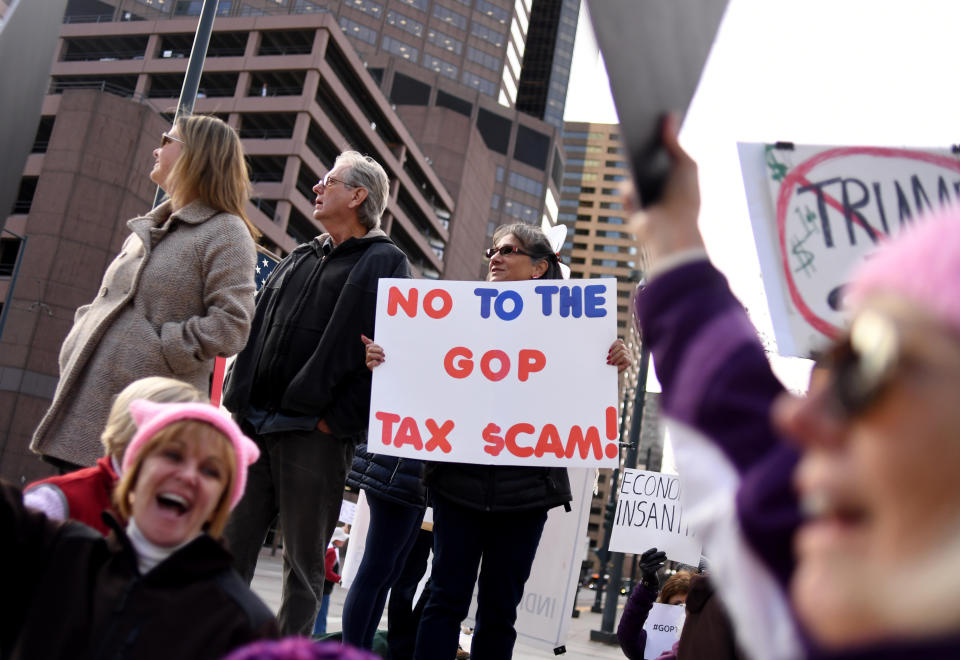 <p>Around a hundred people protested, outside U.S. Sen. Cory Gardner’s Denver office, against a tax bill in the U.S. Senate on Nov. 28, 2017 in Denver, Colo. (Photo: R.J. Sangosti/The Denver Post via Getty Images) </p>