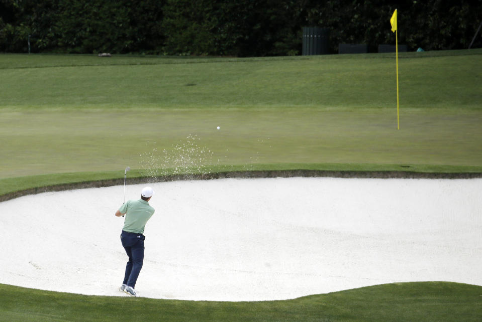 Jordan Spieth chips in for a birdie from a bunker on the fourth hole during the fourth round of the Masters golf tournament Sunday, April 13, 2014, in Augusta, Ga. (AP Photo/Charlie Riedel)