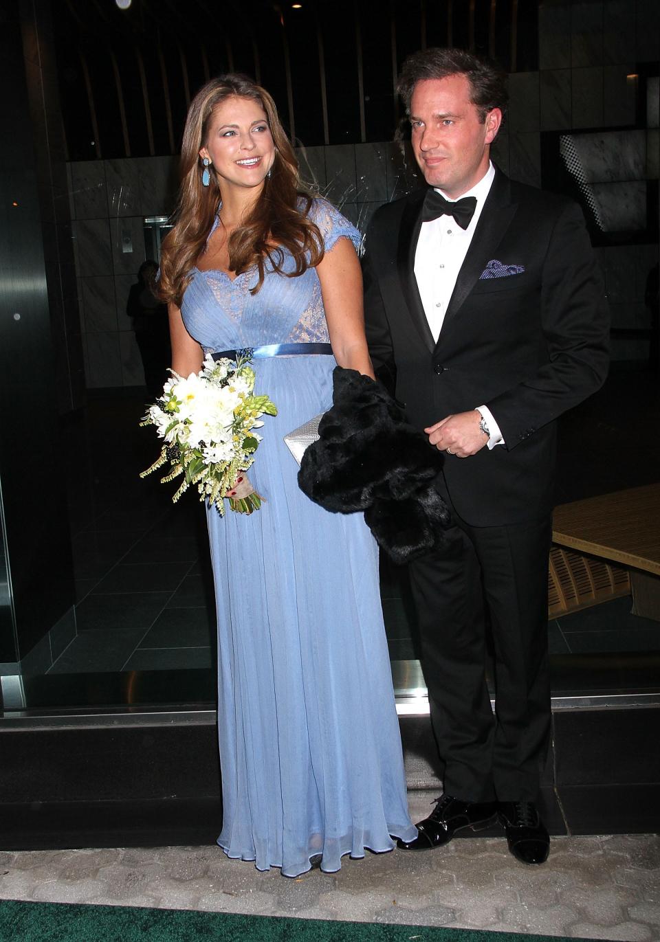 Princess Madeleine of Sweden wears a blue dress