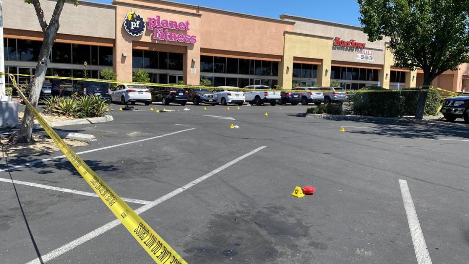 Evidence markers shown after a man was ran over by a vehicle by the Planet Fitness in Fresno, California on Friday, May 17, 2024.