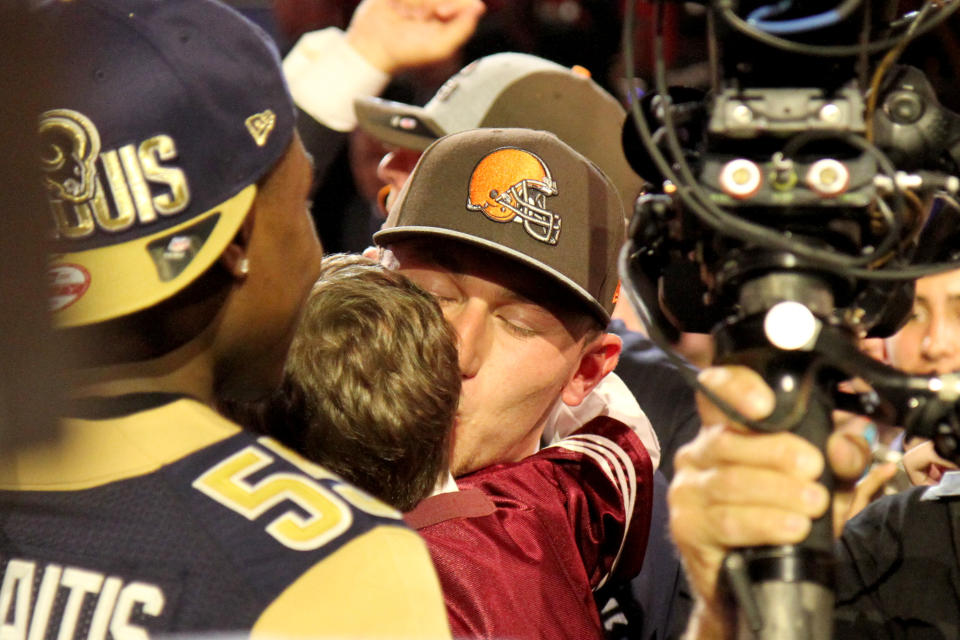 Johnny Manziel of Texas A&M (QB) leaving the stage after being drafted first round (pick 22) by the Cleveland Browns at Radio City Music Hall for the NFL Draft 2014 on Thursday May 8th, 2014 in New York. (Jamie Herrmann/AP Images)