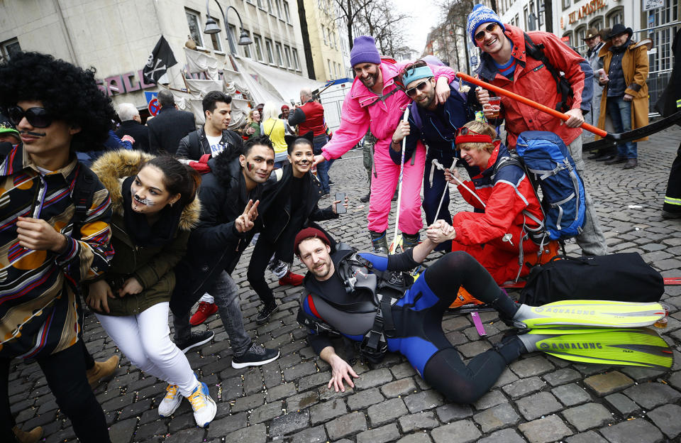 <p>Carnival revellers celebrate during “Weiberfastnacht” (Women’s Carnival) in Cologne, Germany on Feb. 23, 2017, marking the start of a week of street festivals with the highlight “Rosenmontag”, Rose Monday processions. (Photo: Wolfgang Rattay/Reuters) </p>