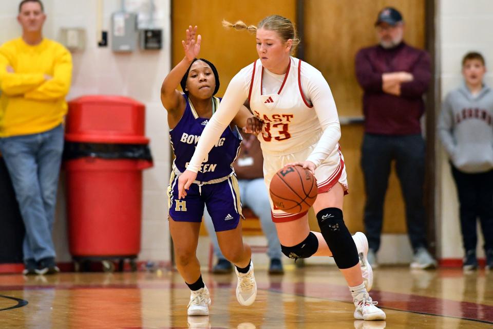 Bullitt East's Mollie Johnston drives around Bowling Green's NaTaya Wardlow during the first half of their Queen of the Commonwealth  game Wednesday night in Mount Washington. Bullitt East won, 43-40.