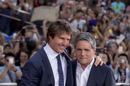 Tom Cruise poses with Chairman and CEO of Paramount Pictures Brad Grey on the red carpet for a screening of the film "Mission Impossible: Rogue Nation" in New York July 27, 2015. REUTERS/Brendan McDermid