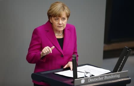 German Chancellor Angela Merkel addresses a session of the Bundestag, the lower house of Parliament, at the Reichstag in Berlin June 4 , 2014. REUTERS/Thomas Peter