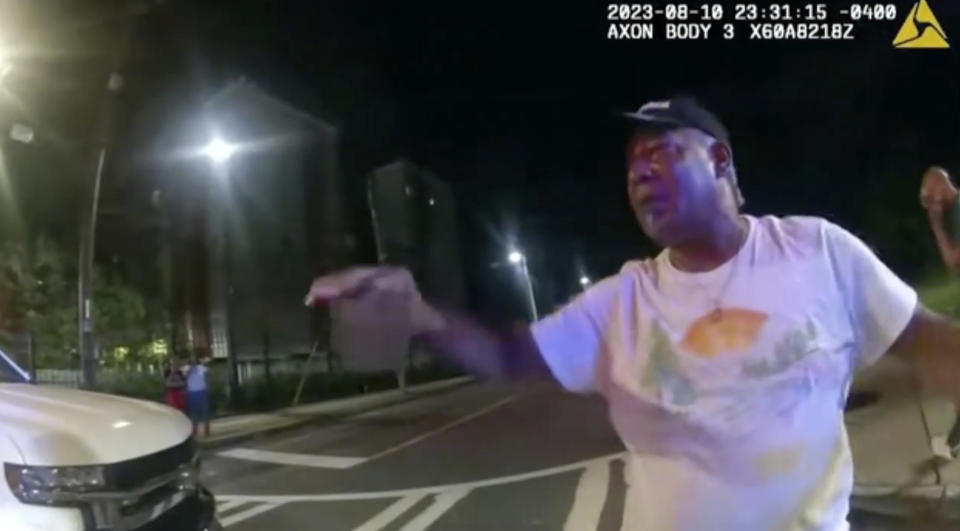 This image from bodycam video provided by the Atlanta Police Department shows Johnny Hollman Sr. speaking with Officer Kiran Kimbrough on Aug. 10, 2023 in Atlanta. The police officer responding to a minor car crash deployed a Taser on the church deacon who disregarded multiple commands to sign a traffic ticket, shocking the man after he repeatedly said he could not breathe, police body camera video released Wednesday, Nov. 22, 2023 shows. Hollman Sr. became unresponsive during his arrest and later died. (Atlanta Police Department via AP)