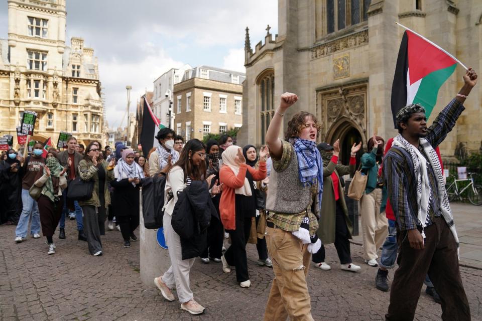 Students march to deliver their demands to Cambridge University as they protest against the war in Gaza (Joe Giddens/PA)