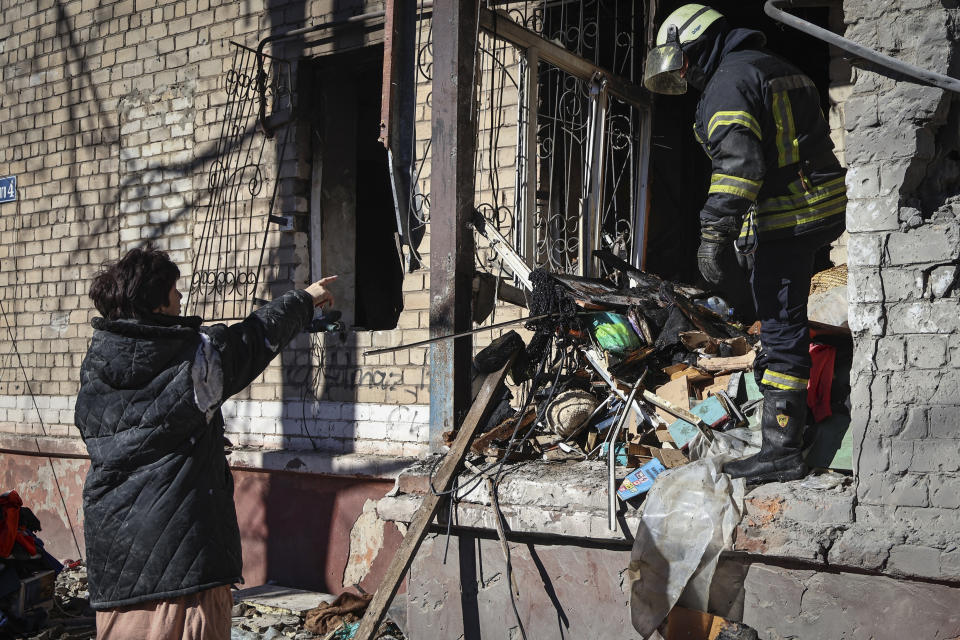 Ukrainian Emergency Service rescuers work on a building damaged by shelling in Kramatorsk, Donetsk region, Ukraine, Tuesday, March 14, 2023. One person has been killed, according to local authorities. (AP Photo/Roman Chop)