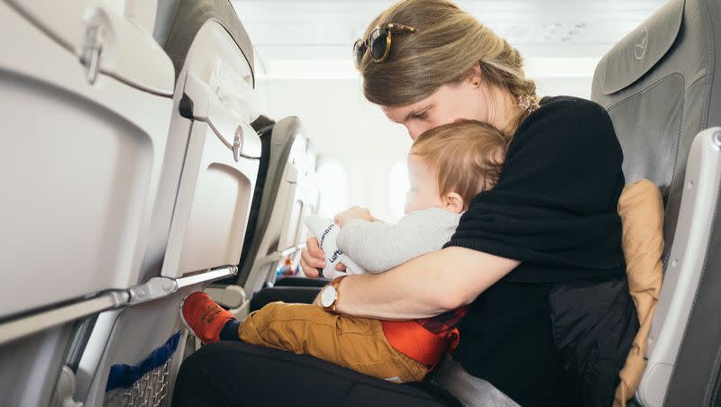 While there are no federal regulations prohibiting parents from holding infants and toddlers on their laps instead of securing them in their own seats, experts warn that doing so is unsafe. 