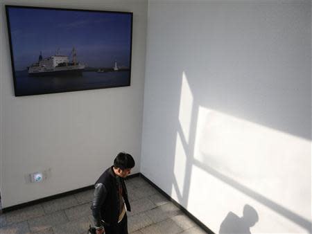 A picture showing South Korean ferry Ohamana owned by Chonghaejin Marine Co is hung on the wall of Incheon Port Passenger Terminal in Incheon April 22, 2014. REUTERS/Kim Hong-Ji