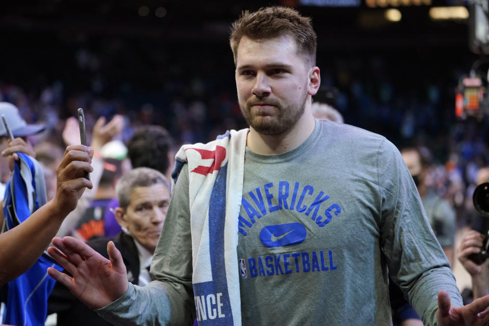 Dallas Mavericks guard Luka Doncic (77) leaves the court after Game 7 of an NBA basketball Western Conference playoff semifinal against the Phoenix Suns, Sunday, May 15, 2022, in Phoenix. The Mavericks defeated the Suns 123-90. (AP Photo/Matt York)