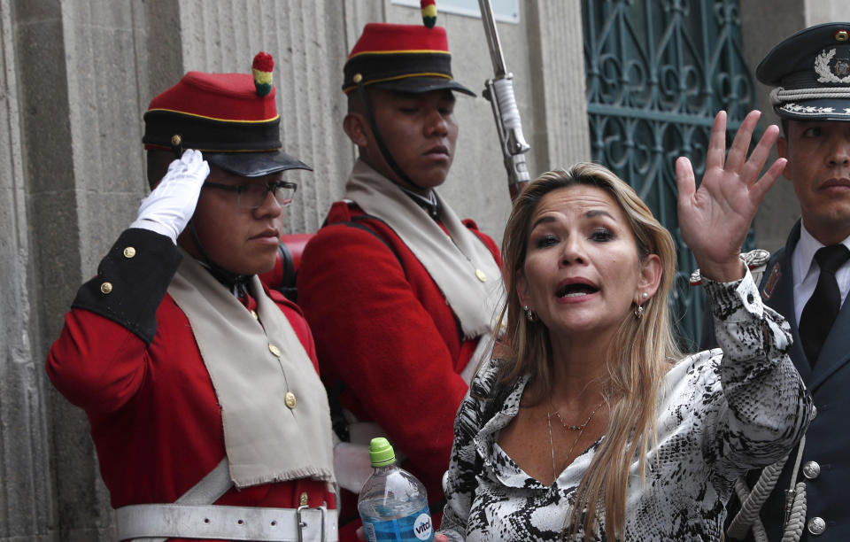 The opposition senator who has claimed Bolivia's presidency Jeanine Anez arrives the government palace in La Paz, Bolivia, Wednesday, Nov. 13, 2019. Anez faces the challenge of stabilizing the nation and organizing national elections within three months at a time of political disputes that pushed former President Evo Morales to fly off to self-exile in Mexico after 14 years in power. (AP Photo/Juan Karita)