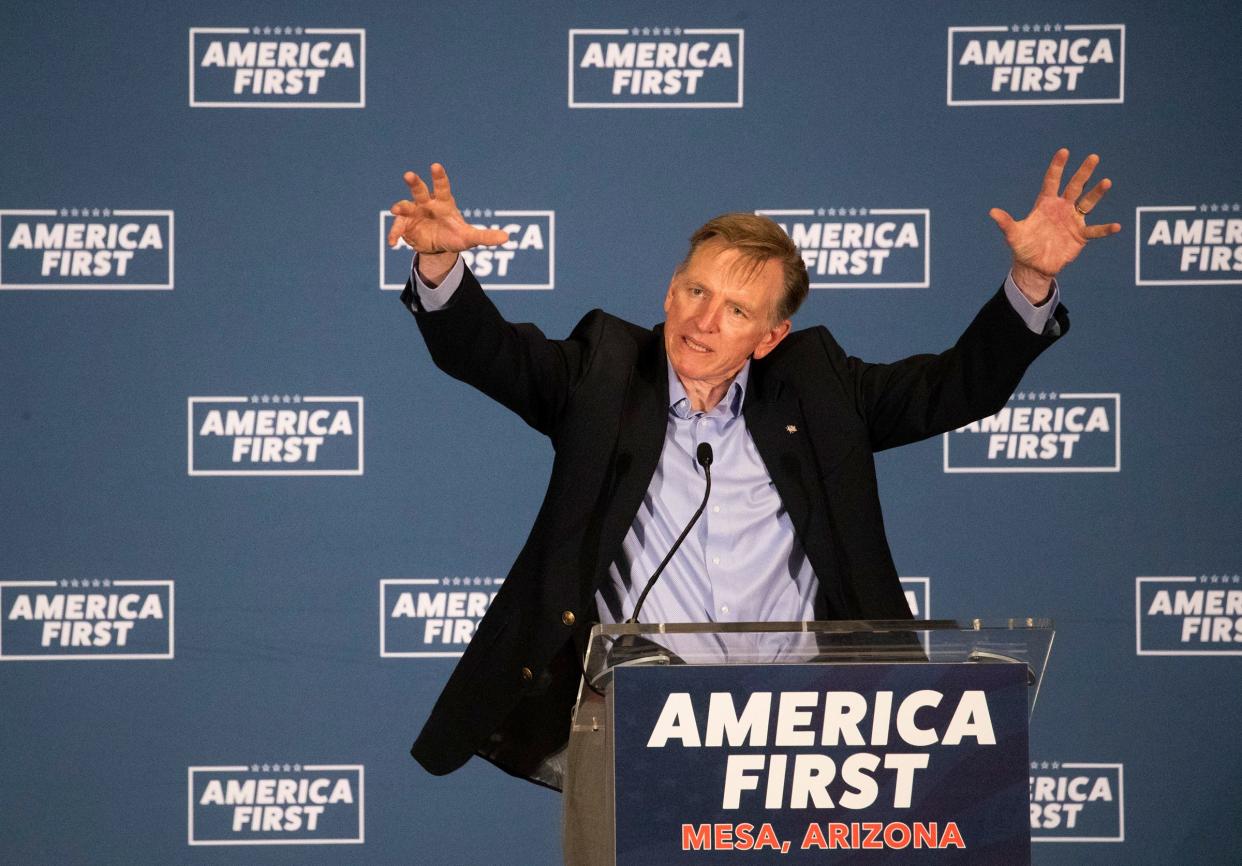 Rep. Paul Gosar, R-Ariz., takes the stage to help out Reps. Matt Gaetz, R-Fla., and Marjorie Taylor Greene, R-Ga., at an America First event in Mesa on March 22, 2021.