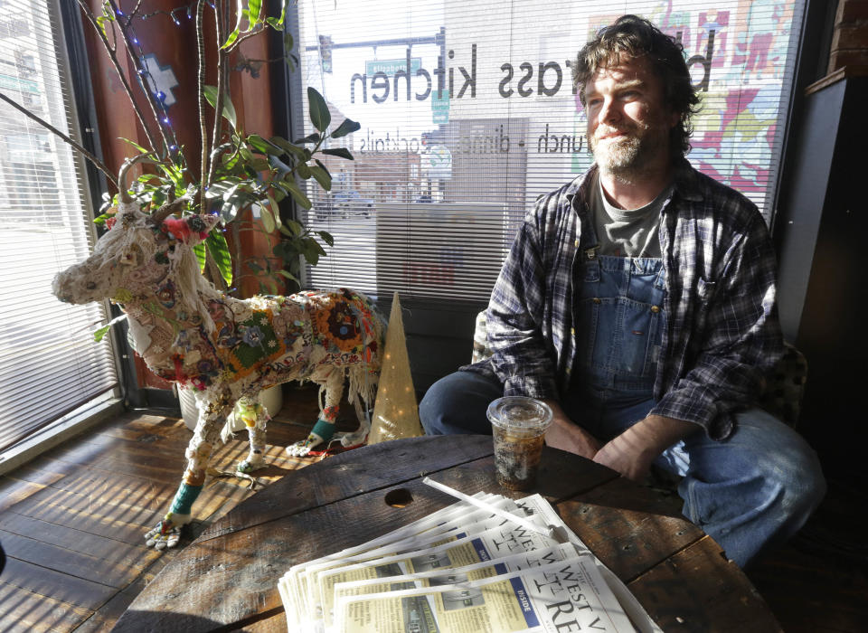 Jonathan Steele, owner of Bluegrass Kitchen, talks about opening his restaurant after the chemical spill in Charleston, W.Va., Tuesday, Jan. 14, 2014. Steele was able to open his restaurant using bottled water on Sunday. He is still using bottled water to cook with. (AP Photo/Steve Helber)